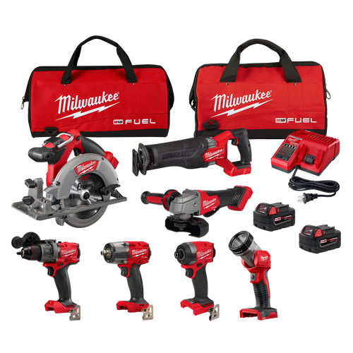 Set of red and black cordless power tools with batteries, charger, and carrying bags for professional home improvement tasks