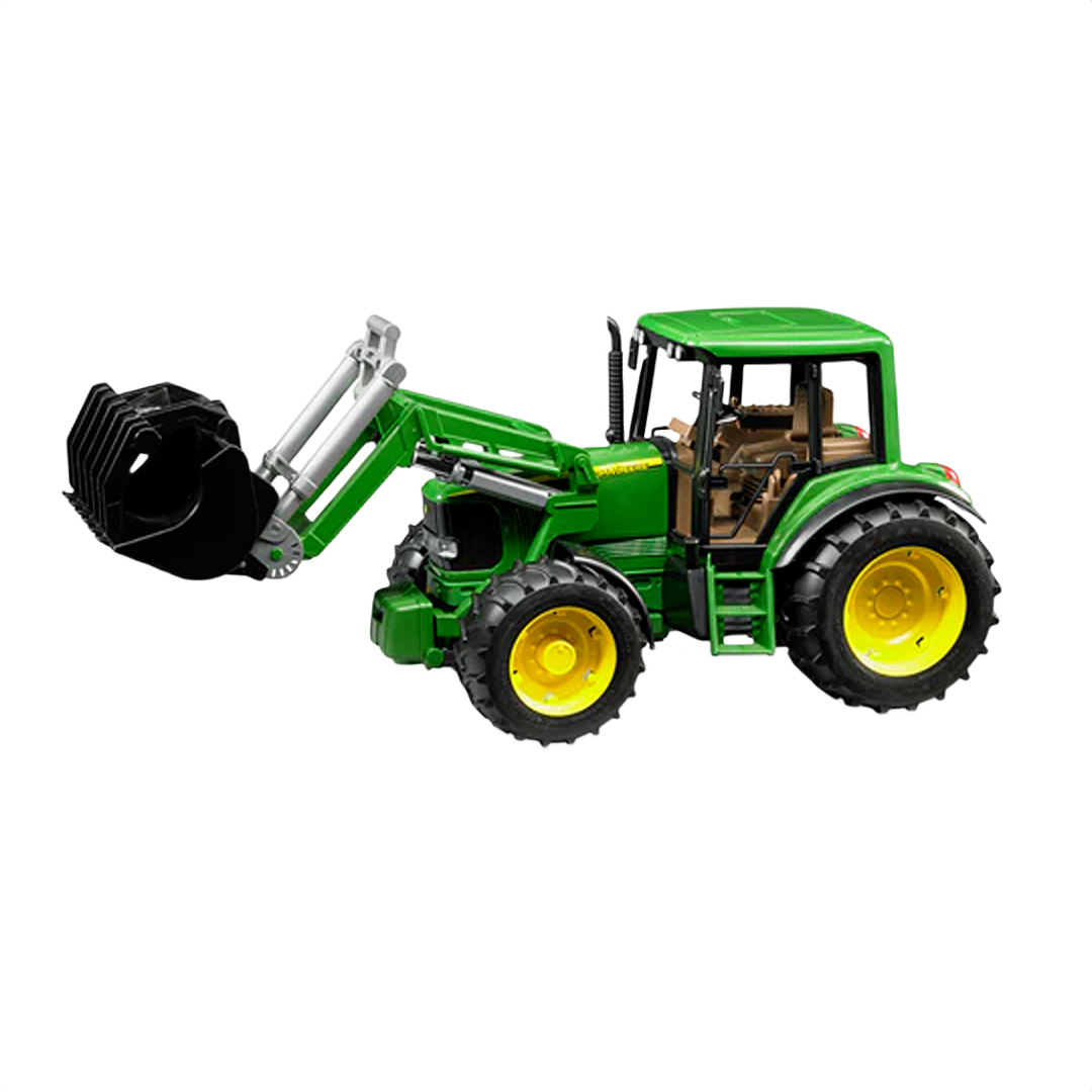 Green and yellow tractor toy with front loader attachment and detailed cabin interior for play or display use