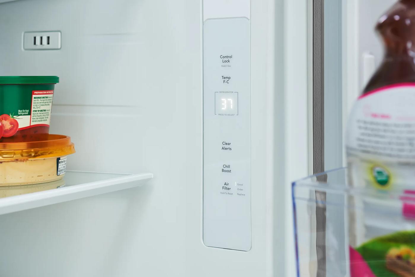 Close-up inside view of a refrigerator door compartment featuring a digital temperature display and control panel, suitable for refrigerators, kitchen & kitchenware, and appliances collections.