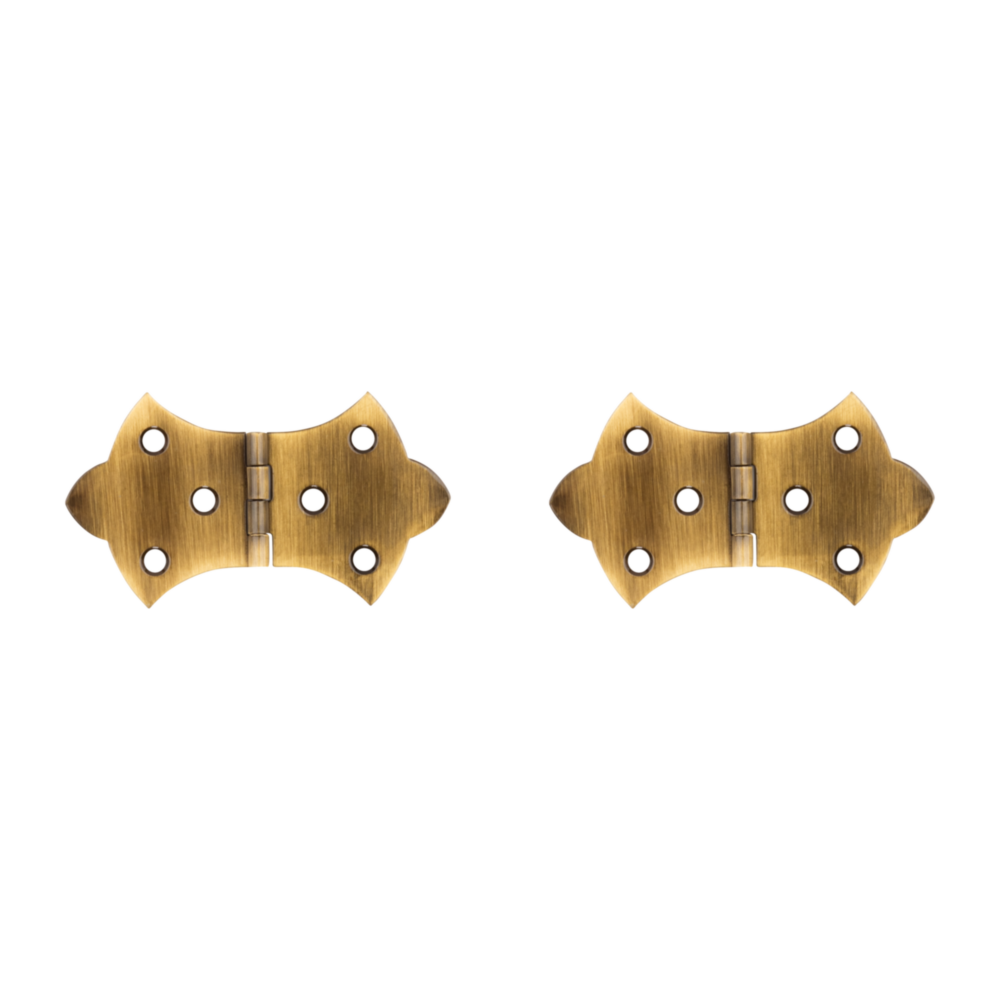Two antique brass decorative hinges with curved edges and six mounting holes each for home improvement projects