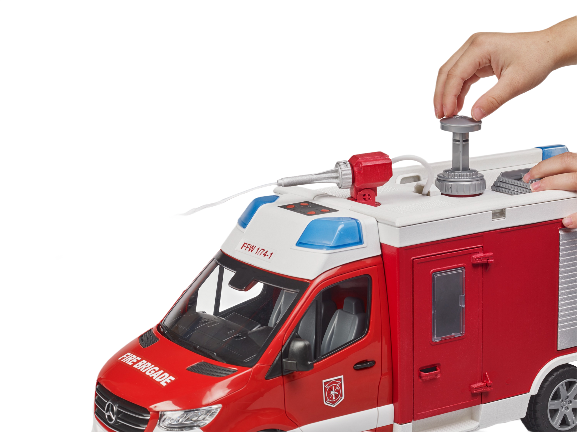 Red and white model fire engine toy with detailed cab, roof equipment, and rotating water cannon being adjusted by hand