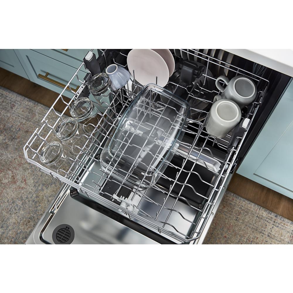 Open dishwasher third rack loaded with glassware, mugs, and cookware in modern kitchen appliances collection