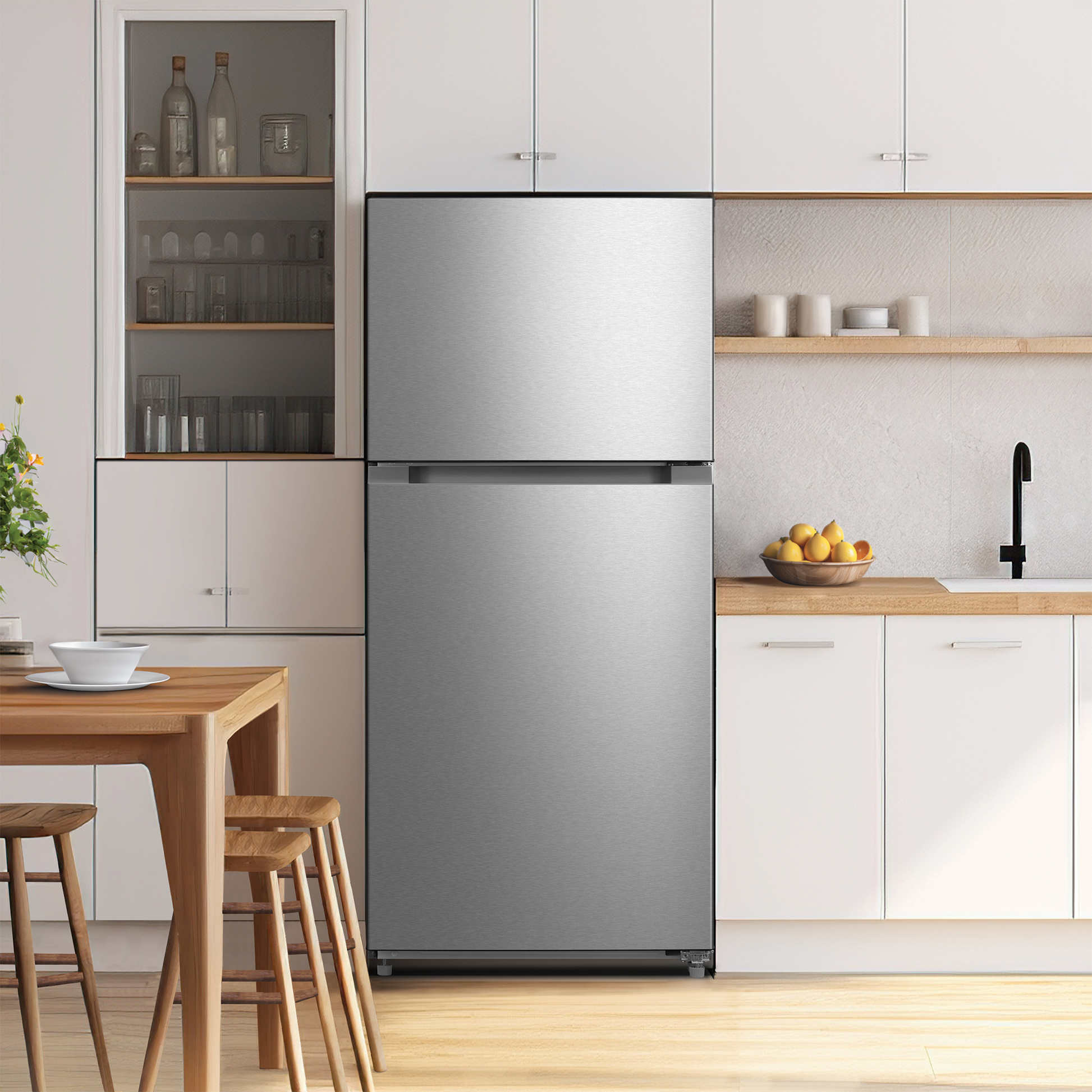 Top freezer refrigerator in stainless steel with minimalist handles in a bright modern kitchen setting for appliances collections