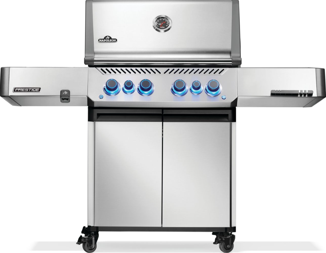 Stainless steel natural gas grill with six illuminated control knobs, side shelves, built-in thermometer, and storage cabinet for outdoor cooking.