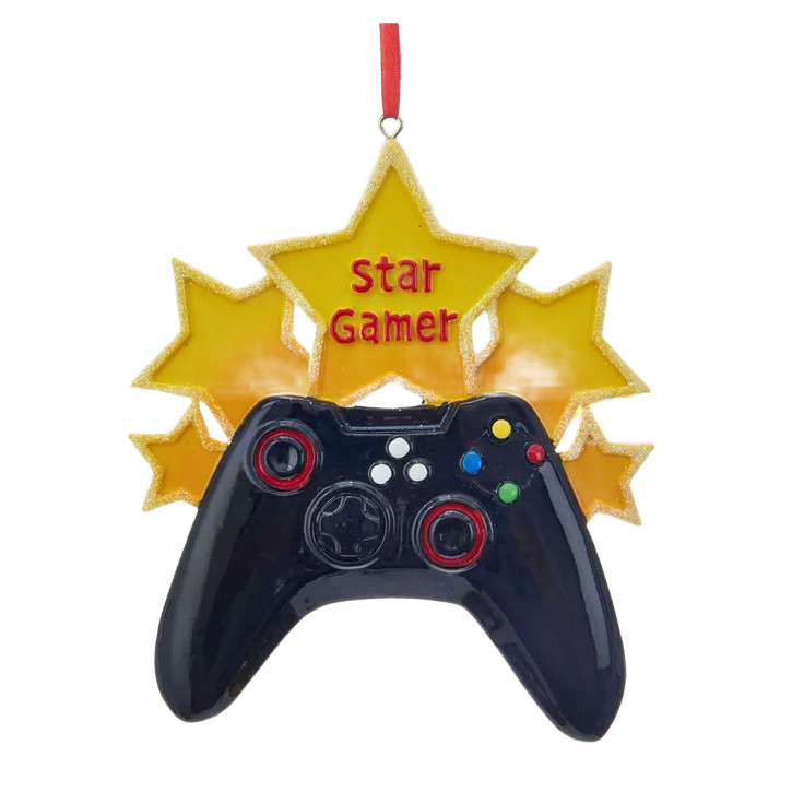 Black game controller ornament with red accents and yellow star backdrop with red "star gamer" text hanging by ribbon