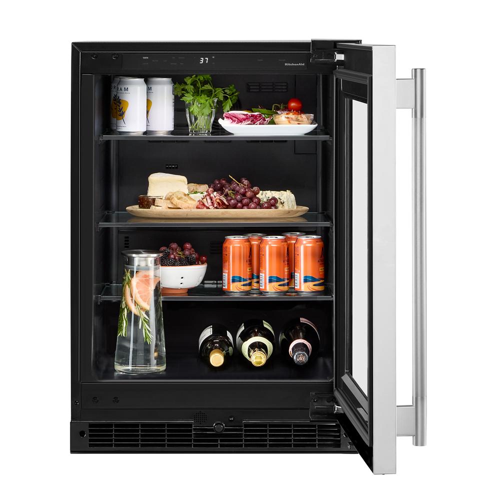 Undercounter refrigerator with glass door, glass shelving stocked with drinks and snacks in Appliances at Hartville Hardware