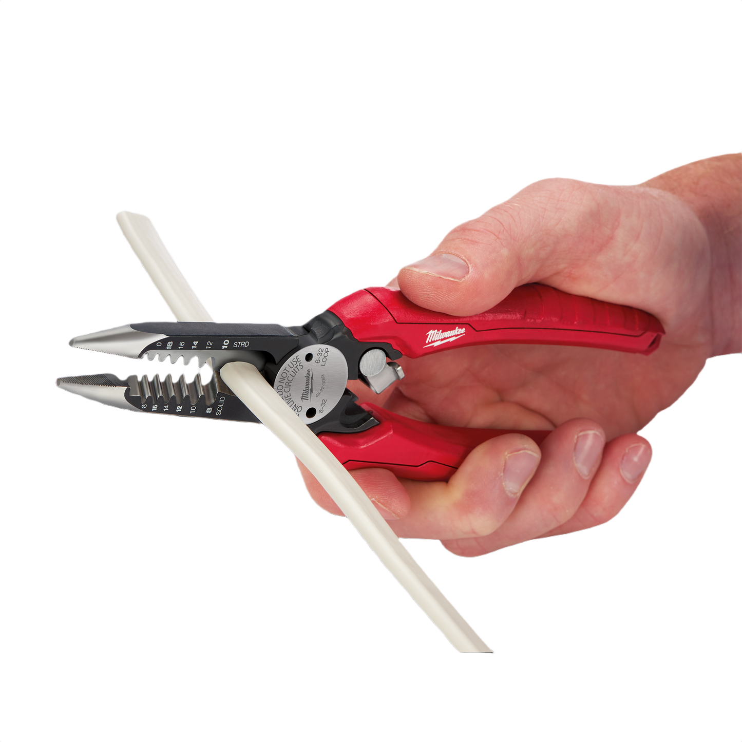 Hand gripping red comfort grip pliers stripping white electrical wire for home improvement tools collection