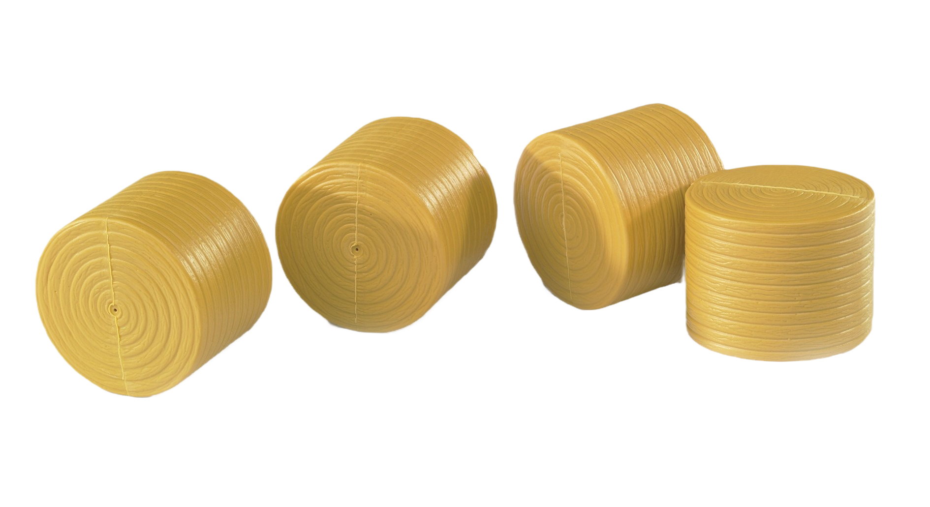 Four yellow plastic round bales designed as detailed miniature accessories for Bruder Claas Rollant 250 models