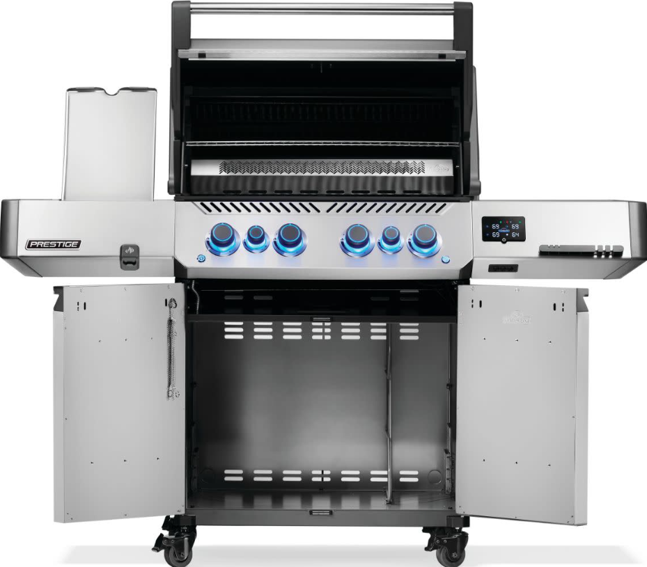 Stainless steel natural gas grill with six blue-lit control knobs, LED display, open lid showing grill grates, and storage cabinet on caster wheels for outdoor living and grilling.