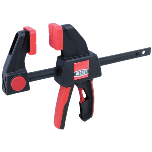 Black and red trigger clamp with ergonomic handle and adjustable jaws for home improvement and woodworking tasks