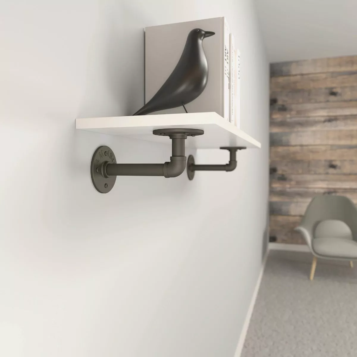 Industrial-style 8-inch natural steel elbow pipe brackets supporting a white floating shelf in modern home storage setup