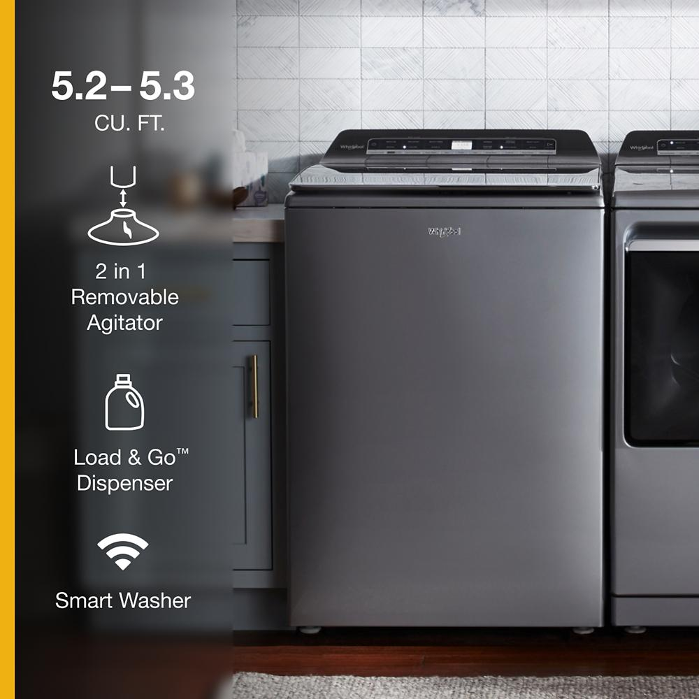 Gray top load washer with digital control panel and Load & Go detergent dispenser in modern laundry room setting