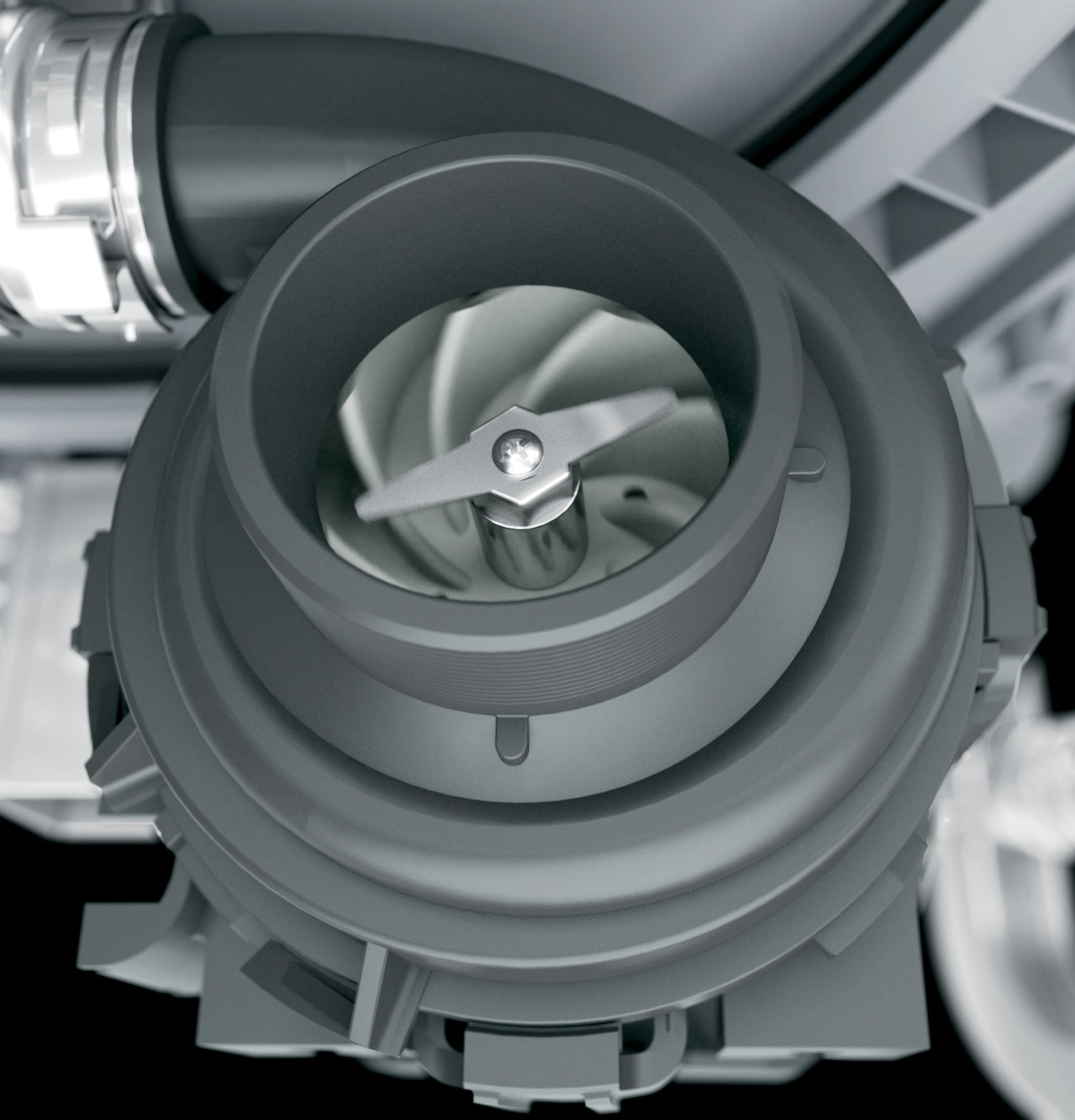 Close-up of dishwasher pump and motor assembly inside stainless interior appliance from kitchen appliance collection.