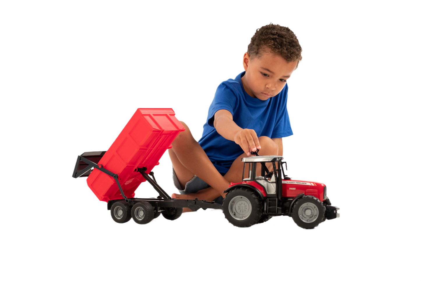 Child playing with red Massey Ferguson 7480 tractor and dumping trailer toy in Vehicles & Remote Controlled Toys collection