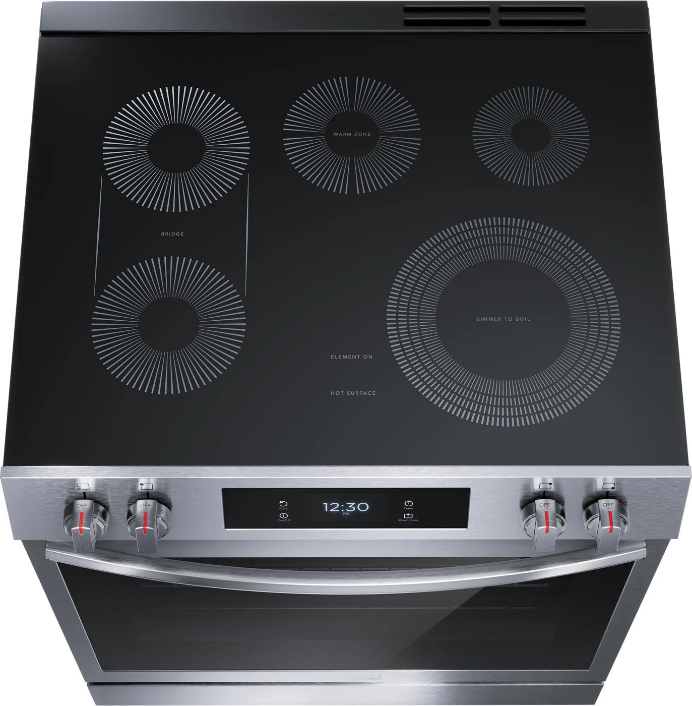 Top view of electric range with smooth glass cooktop, front control knobs, and digital display in kitchen appliances collection