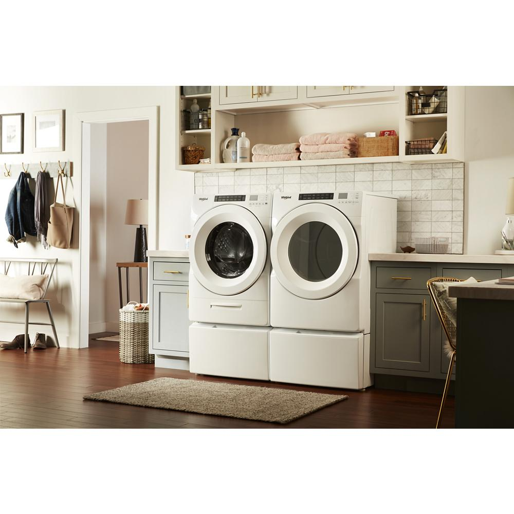 White front load washer and electric dryer pair with pedestal stands in stylish home laundry area for appliances and home improvement.