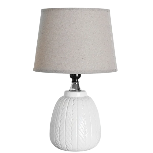 Table lamp with textured white ceramic base and neutral fabric shade in lighting and electrical collections
