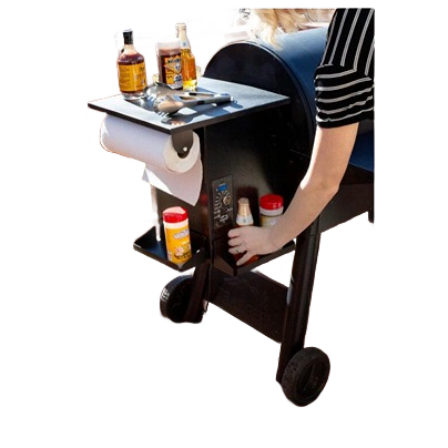 Compact magnetic spice rack attached to grill with seasonings and paper towel holder for outdoor grilling accessories