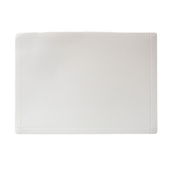 Oversized white disposable cutting board made from coated stock for outdoor grilling and kitchen prep use under $50