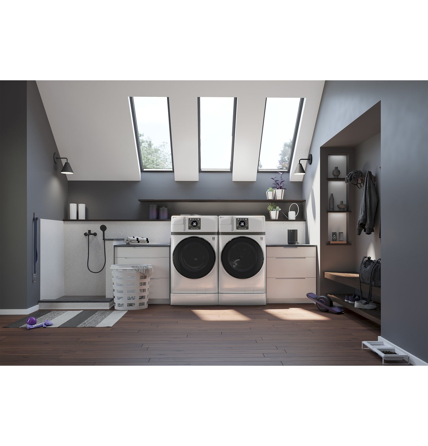 Modern laundry room with white front load washer and dryer combo under skylights, featuring wood flooring and gray walls.