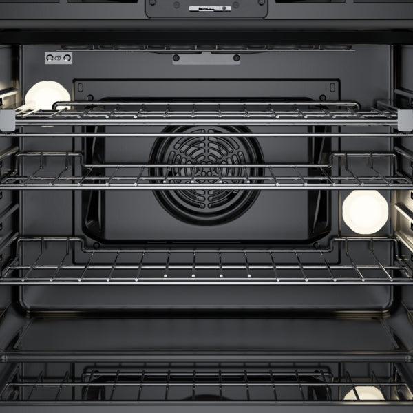 Interior view of stainless steel 30-inch single wall oven with convection fan and multiple wire racks from Bosch appliances collection