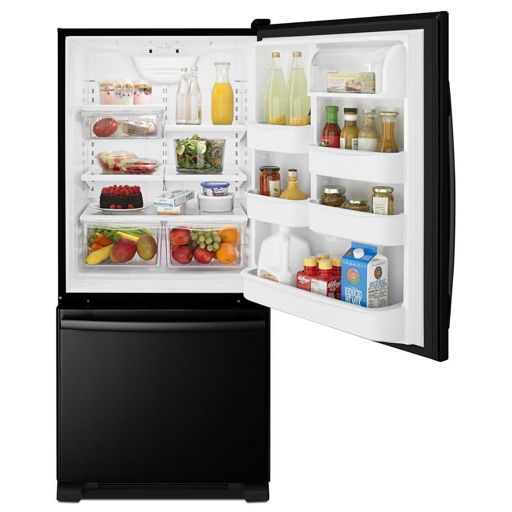 Black 29-inch wide bottom-freezer refrigerator open showing organized fresh food storage in kitchen appliances collection