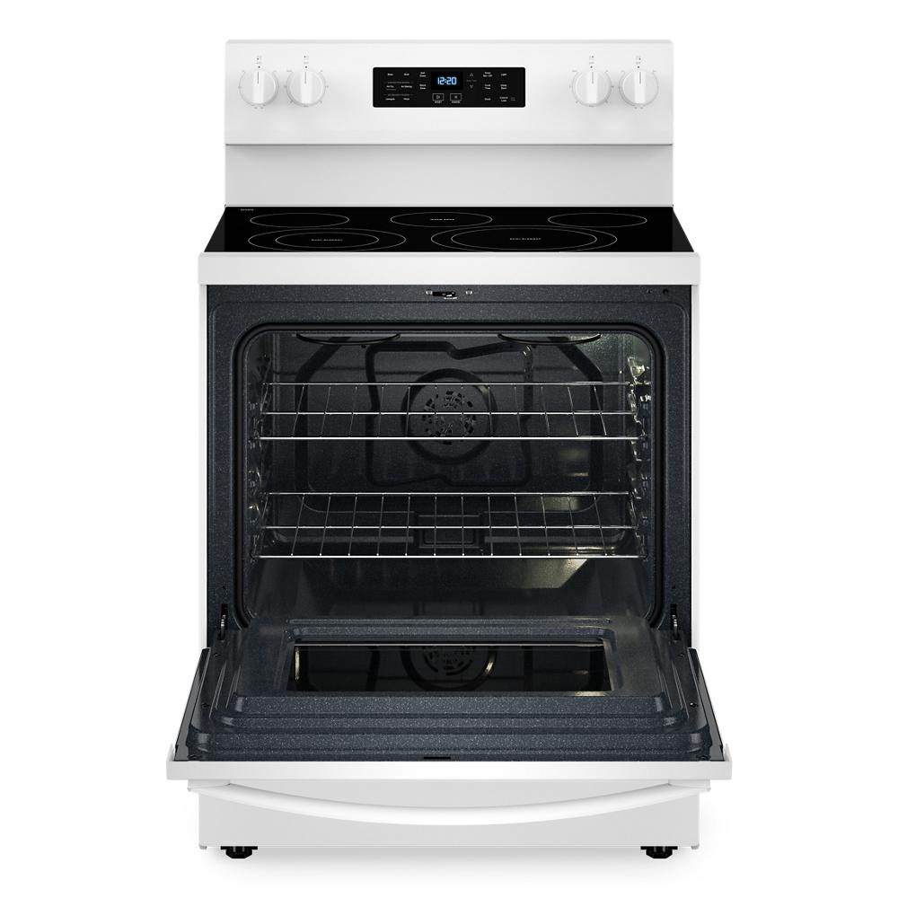 White 30-inch electric range with open oven door showing racks and smooth black glass cooktop in kitchen appliance collection