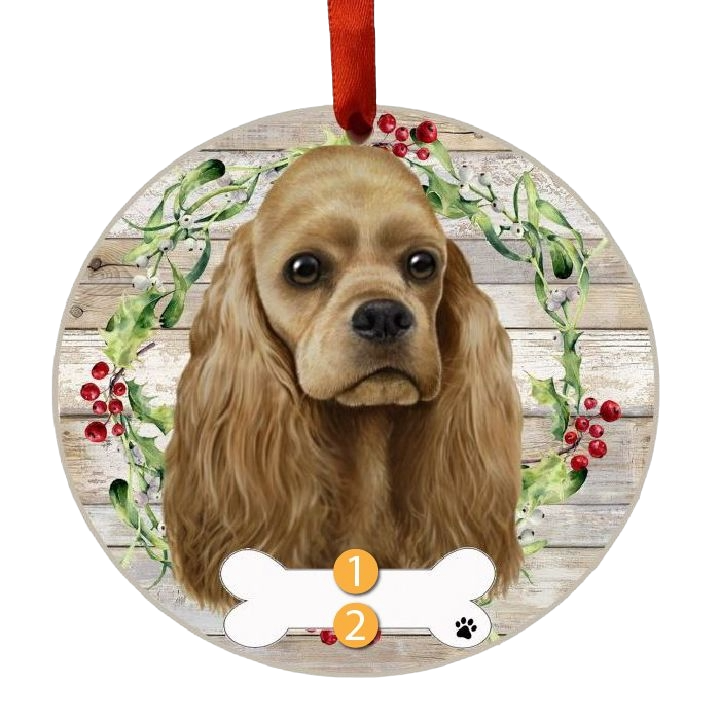 Round Christmas ornament with a Buff Cocker Spaniel face and festive wreath on rustic wood background