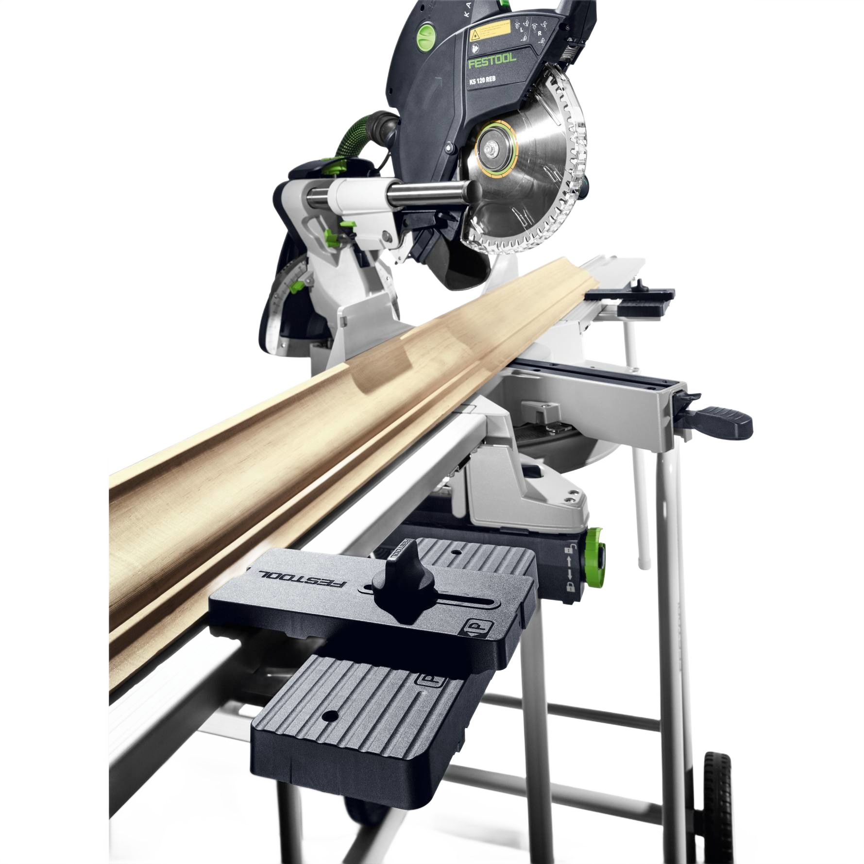 Festool Kapex sliding compound miter saw with crown stops supporting angled molding on saw accessories and tool stand