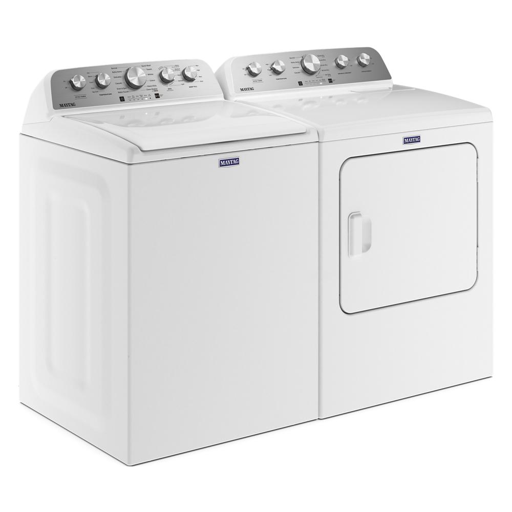 Pair of white Maytag top load washer and electric dryer with control knobs and doors in washers and dryers collection