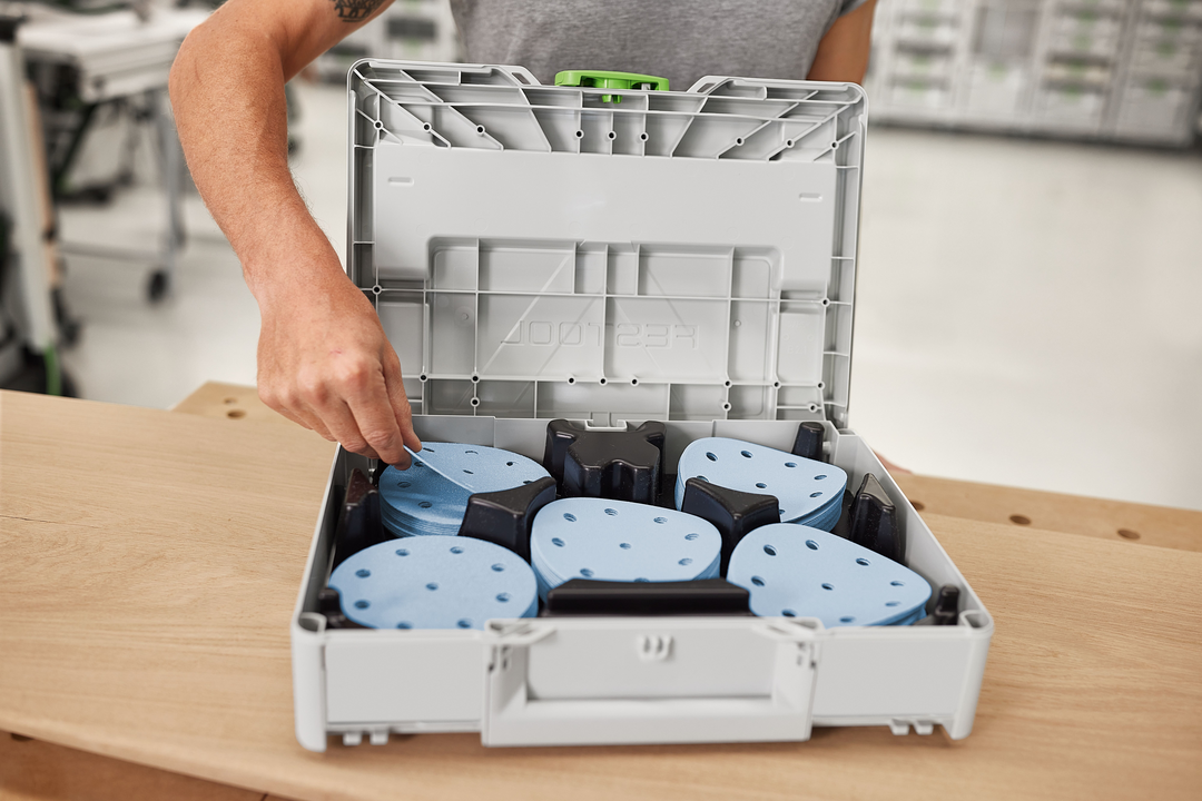 Gray plastic case with organized blue sanding discs for power tool abrasives in home improvement and tool accessories collections