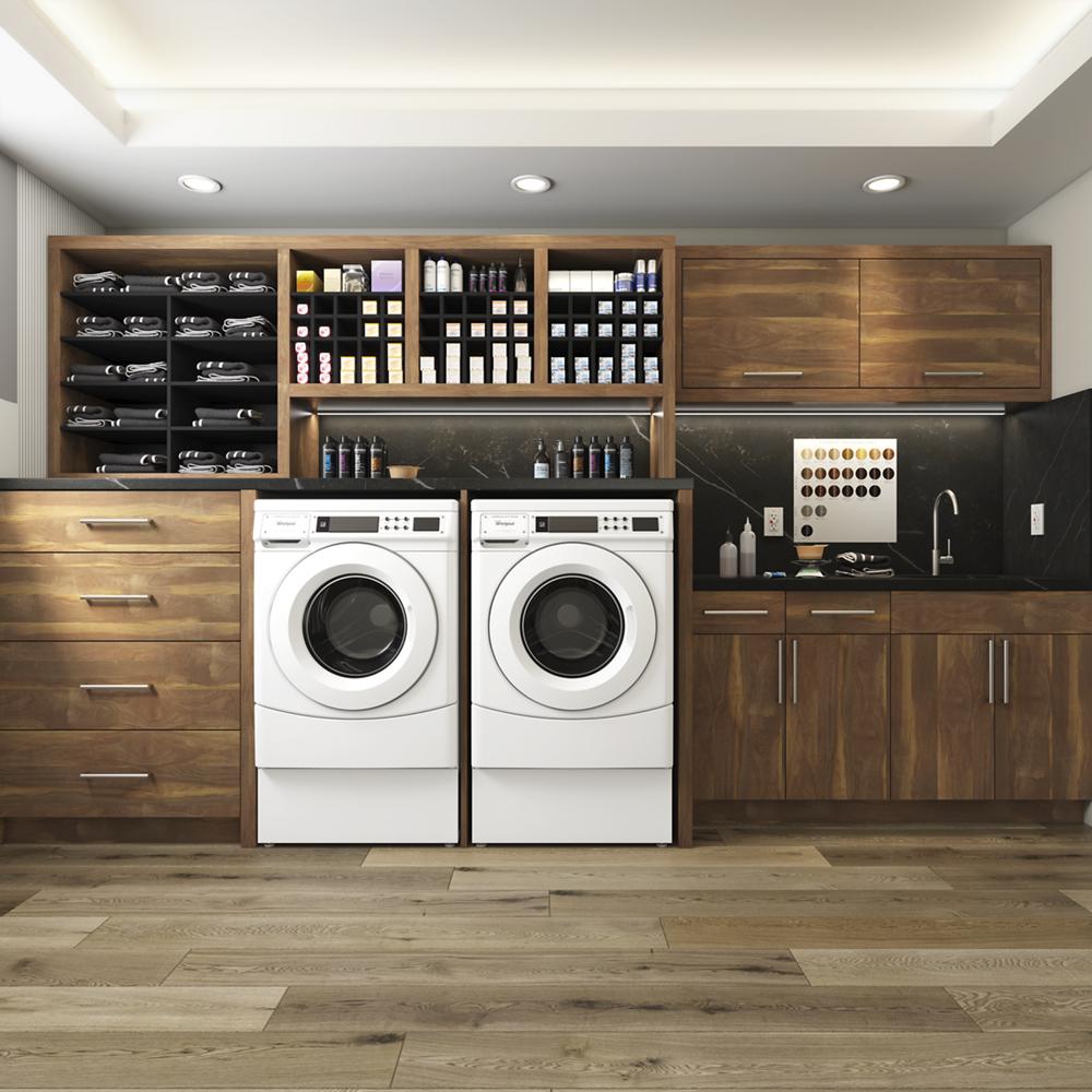 Contemporary laundry room featuring two white front-load washers surrounded by dark wood cabinetry and organized storage shelves