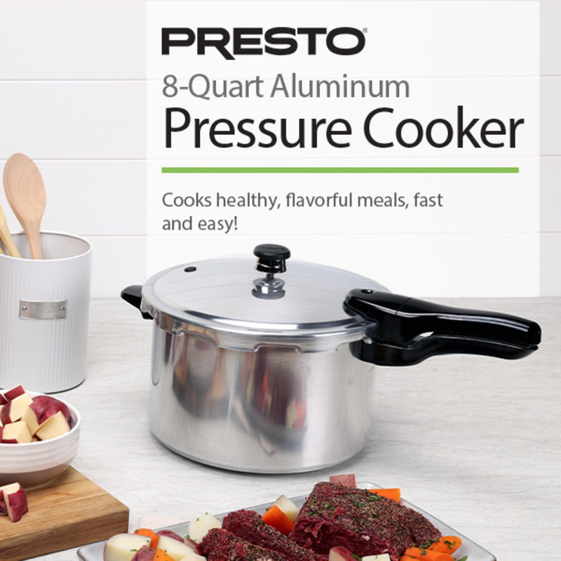 Polished aluminum pressure cooker with black handle shown with fresh vegetables and cooked meal in kitchenware collection