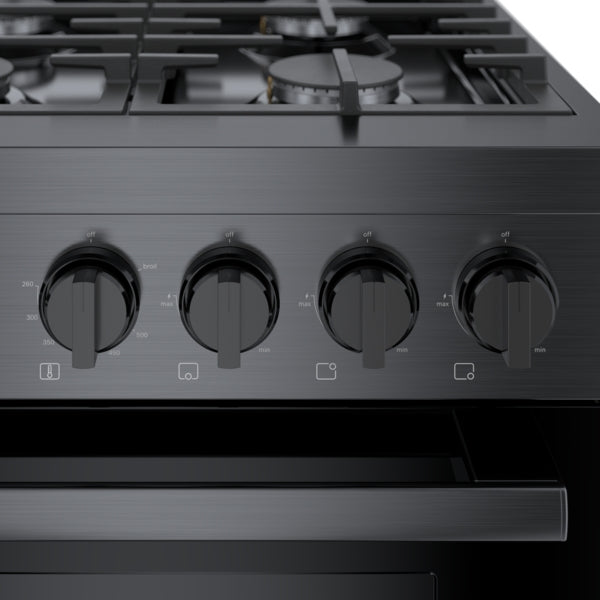 Close-up of black stainless steel gas range control panel with four heavy-duty metal knobs and integrated icons for kitchen appliances collection