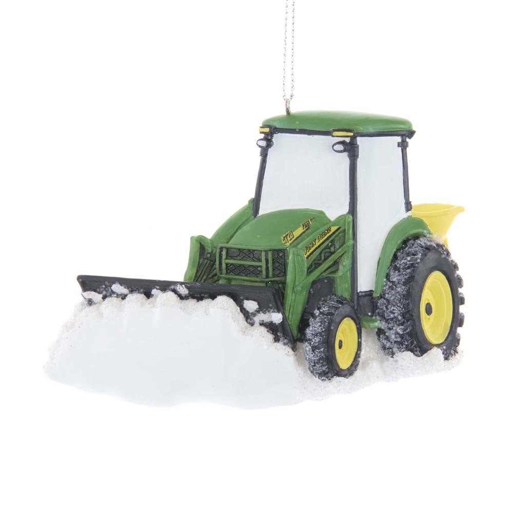 Green tractor ornament with snow plow clearing snow and hanging string for holiday decoration display