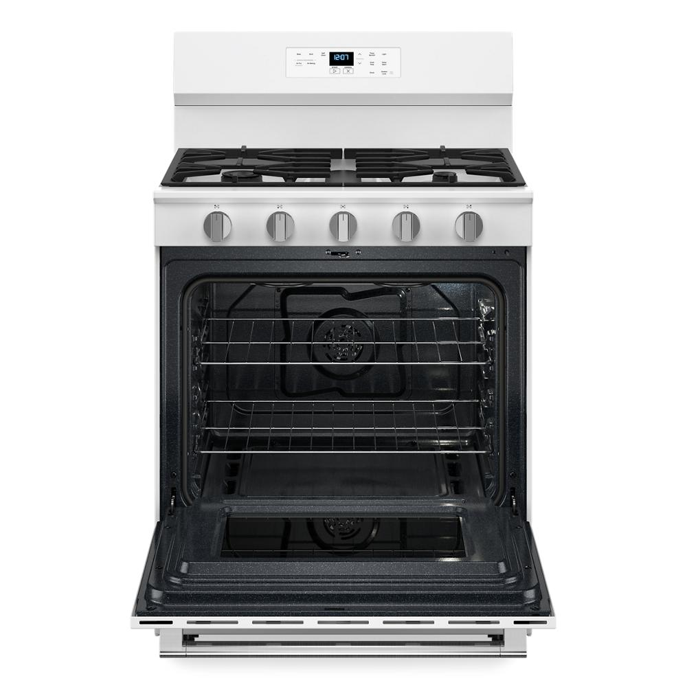 White 30-inch gas range with open oven door, five control knobs, digital display, and four burners from kitchen appliances collection