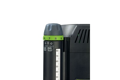 Close-up of black and green depth adjustment dial and measurement scale on professional woodworking router tool