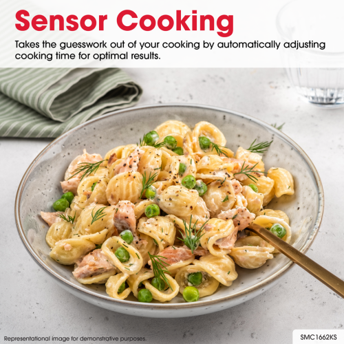 Creamy pasta with peas and salmon in a grey bowl, demonstrating sensor cooking for kitchen appliances and microwaves