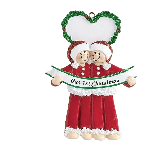 Male couple ornament in red holiday outfits holding "Our 1st Christmas" banner with green heart wreath from Christmas decorations collection