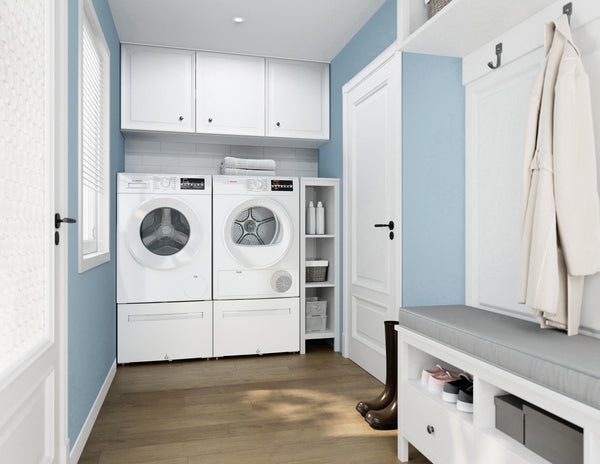 White front load washer and dryer in a bright laundry room with blue walls and wooden flooring