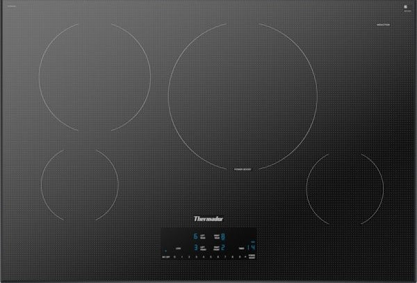 Thermador induction cooktop in silver mirror finish with four cooking zones and illuminated touch controls at Hartville Hardware