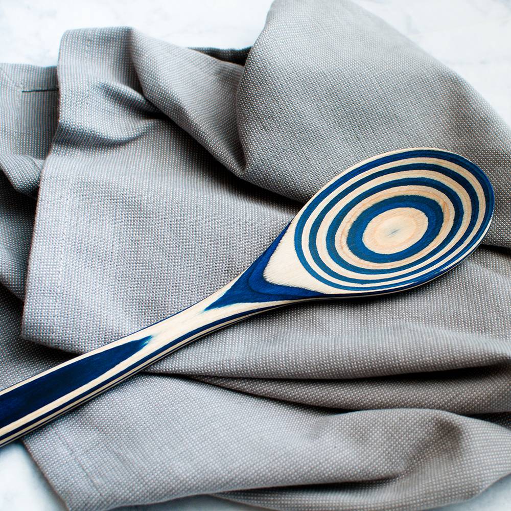 Twelve-inch pakkawood spoon with a blue and natural concentric circle pattern, suitable for Kitchenware, Kitchen Utensils, and Under $50 collections.