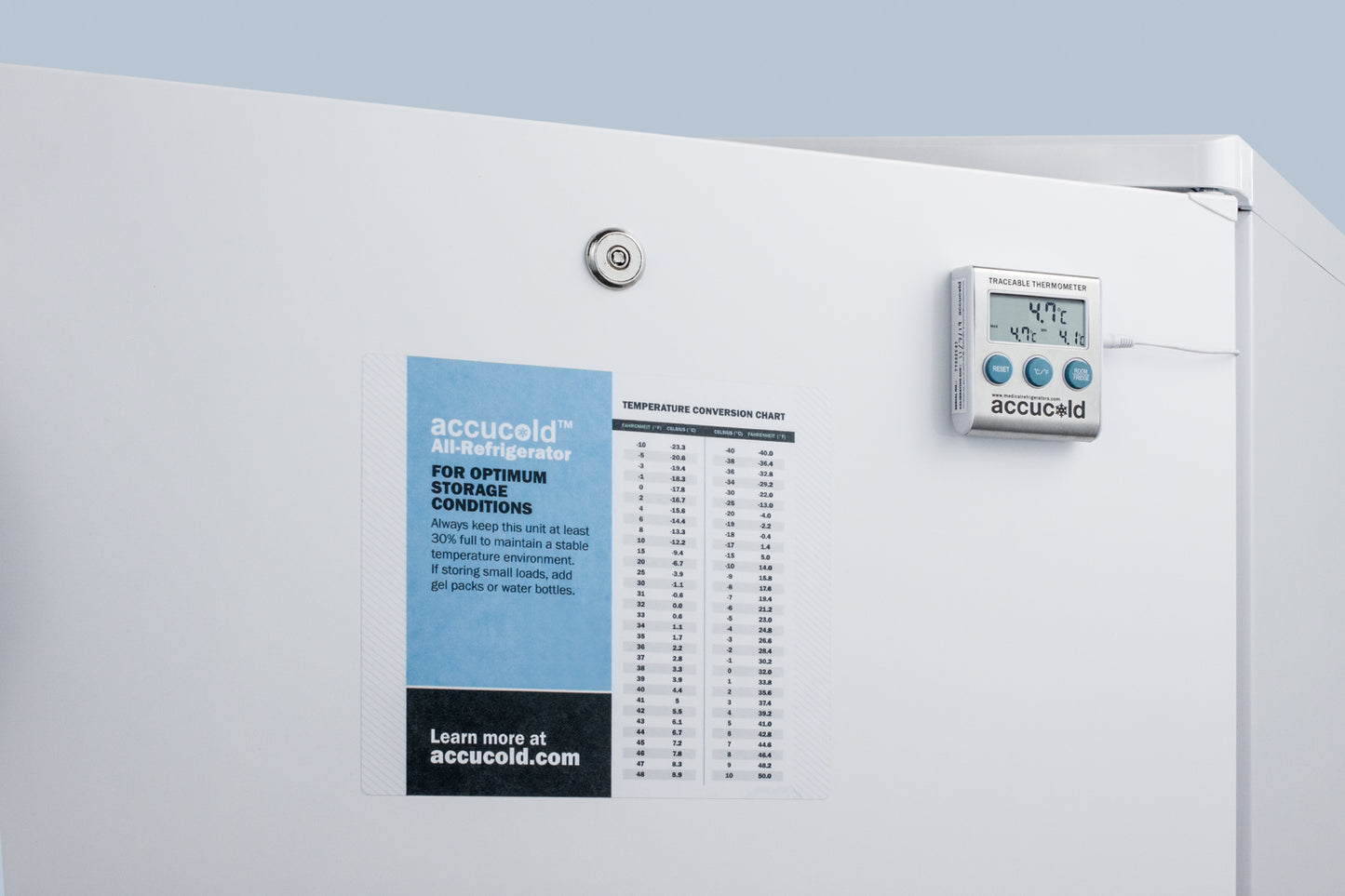 White freestanding commercial refrigerator door with keyed lock, temperature chart, and digital temperature display panel