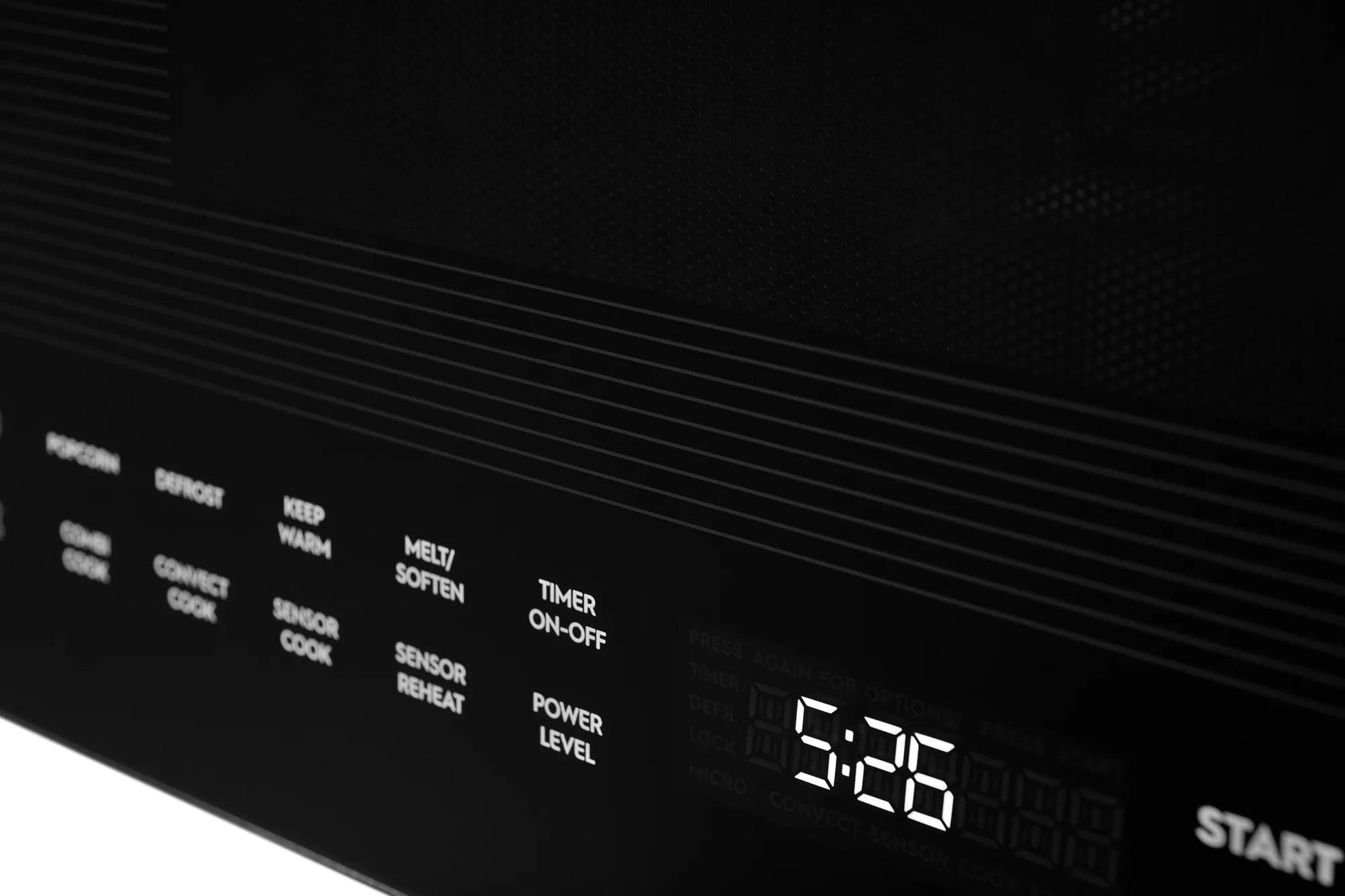 Close-up of black built-in microwave panel with digital clock, touch controls, and cooking function labels from kitchen appliances collection