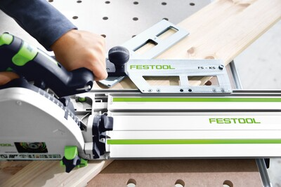 Festool track saw cutting wood on multifunction table with guide rail in woodworking tools and tool stands collections