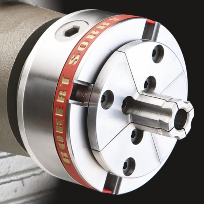 Close-up of silver metal chuck with dovetailed pin jaws for woodworking tool accessories and home improvement use