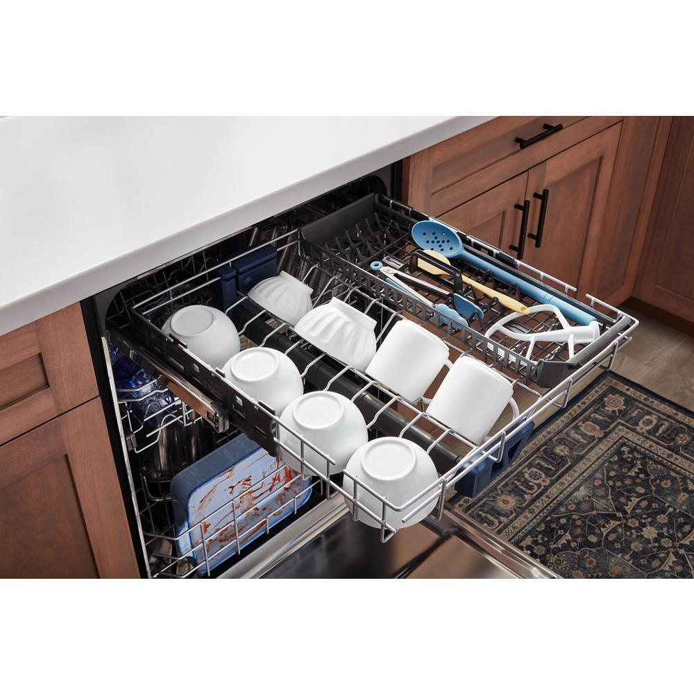 Open top control dishwasher rack with white cups, bowls, utensils, and plate in kitchen and home improvement setting