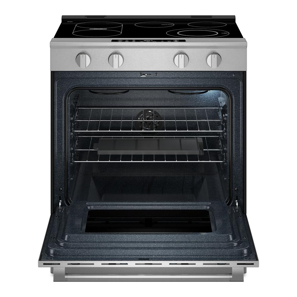 Stainless steel slide-in electric range with open oven door showing racks and interior light in kitchen appliance setting