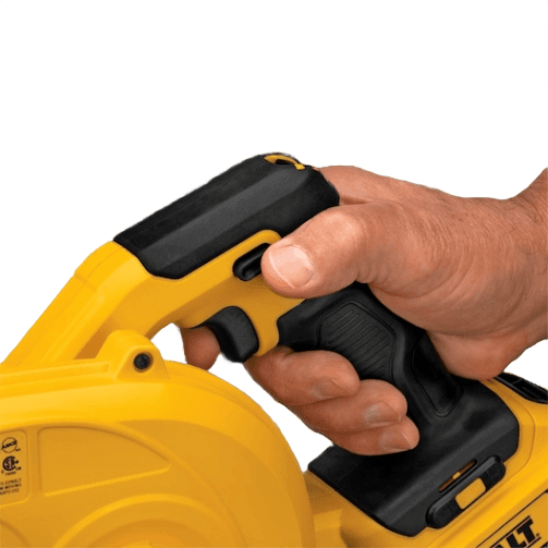 Close-up of a hand gripping a yellow and black compact cordless blower handle for home improvement tasks