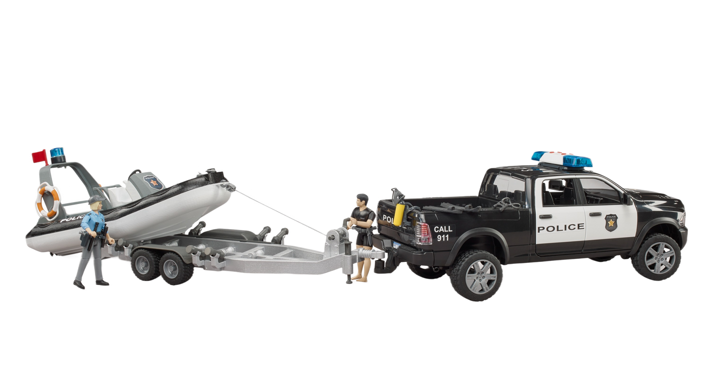 Black and white police pickup toy towing a trailer with inflatable boat and three officer figures for play